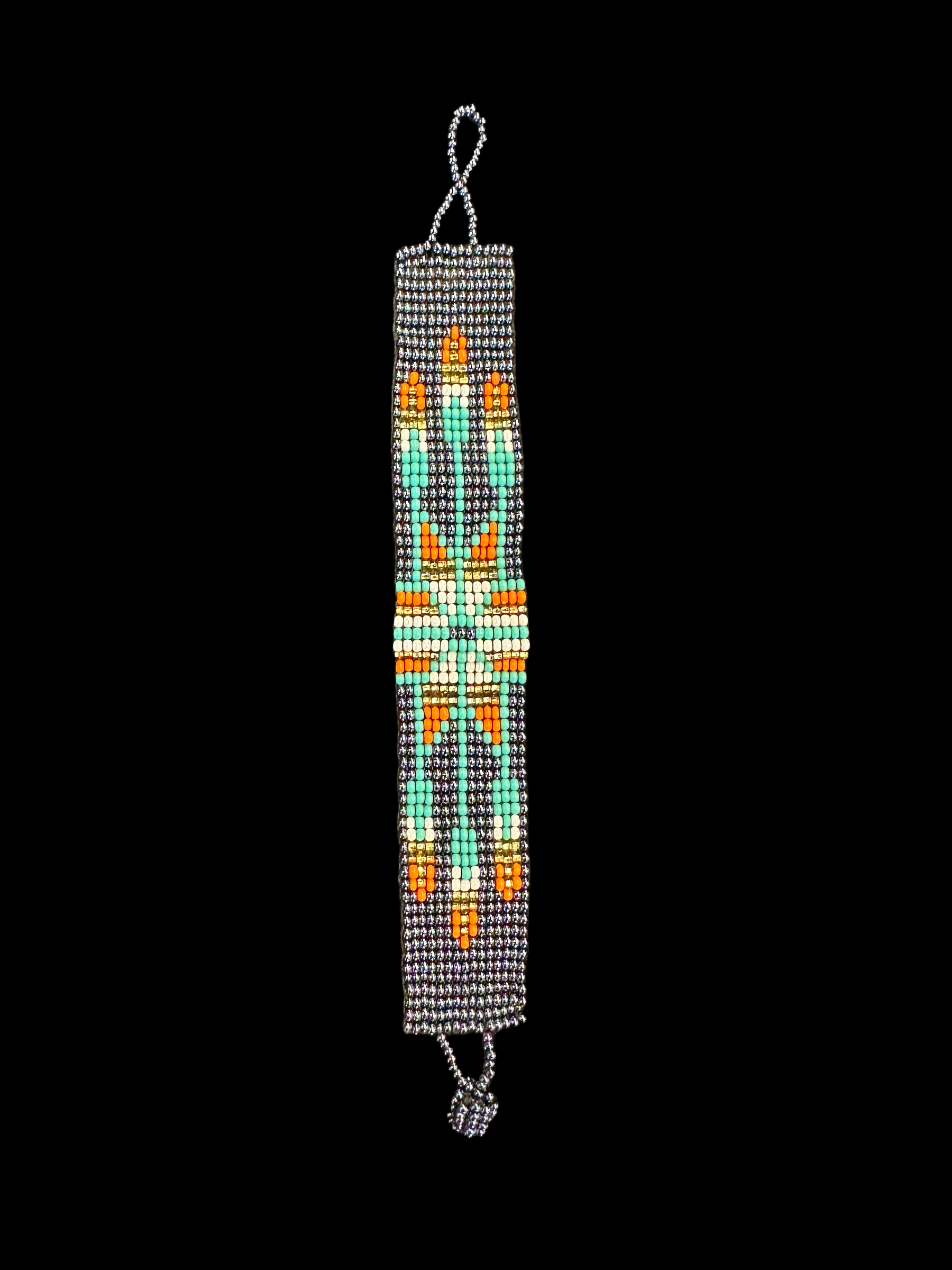 This beautiful hand-made Guatemalan accessory is a great addition to any jewelry collection! The bracelet boasts fun, vibrant colors inspired by the vibrant palette of the native culture. It's sure to turn heads with its unique design and beautiful hues. Add a bit of fun and excitement to your look with the Arrow Maya Design Bracelet!