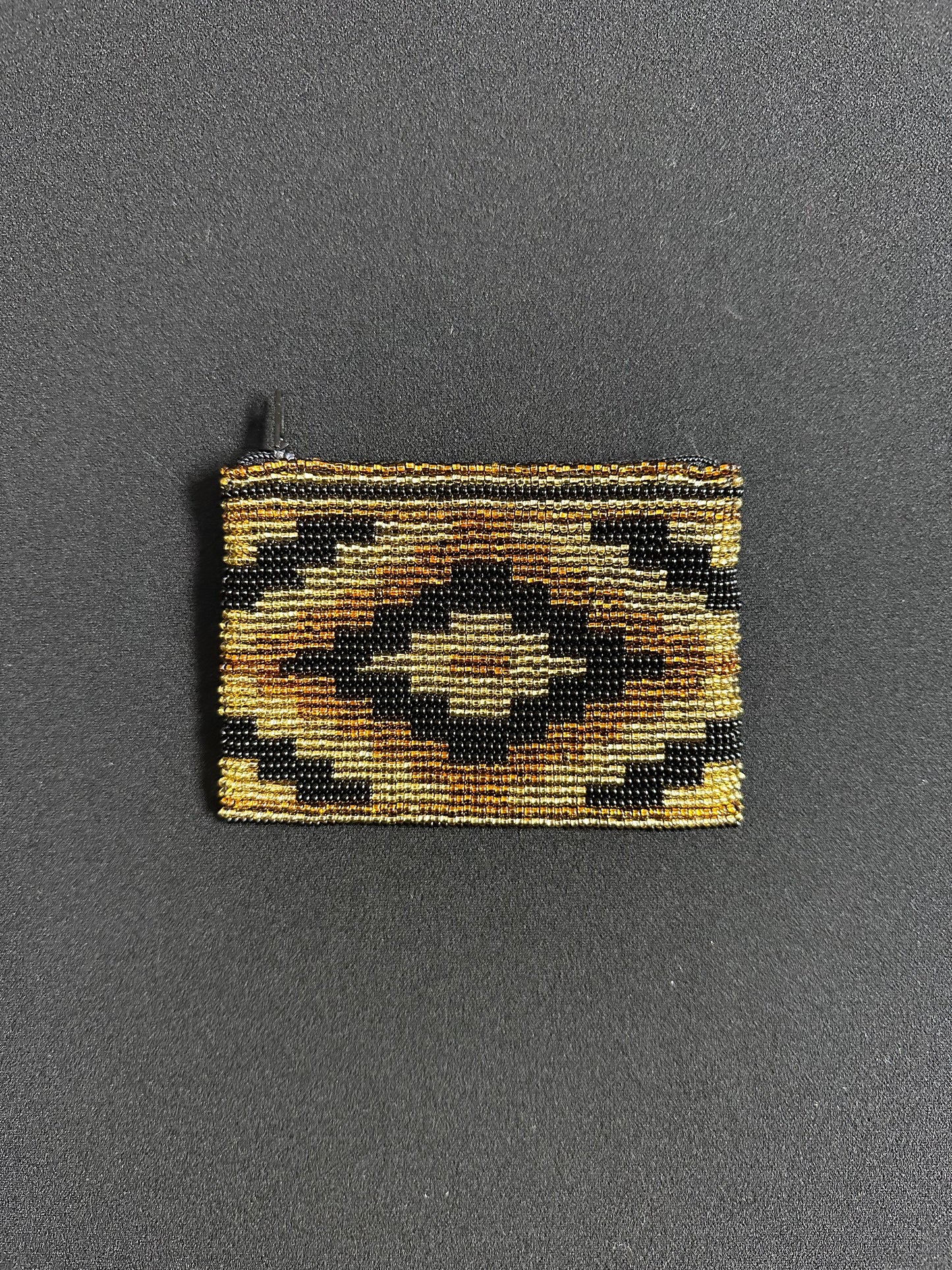 These Guatemalan Hand Beaded Coin Purses are a handcrafted piece of art. Handmade with beads, each purse is lined with a silky nylon lining and closes with a zip-top closure. They are great for organizing items in your purse or bag, and hold credit cards, IDs, metro passes, and change. Perfect for everyday use.