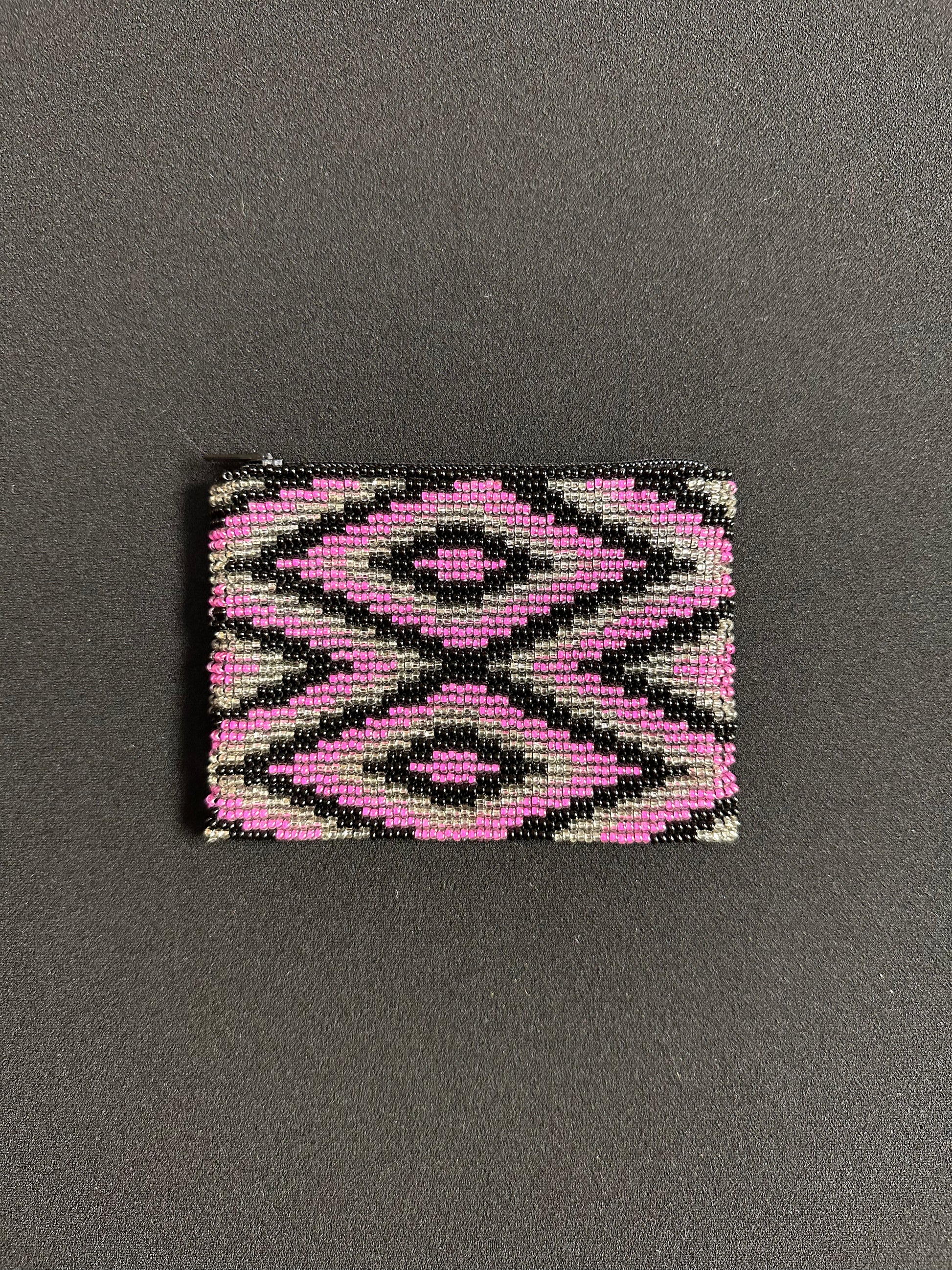 These Guatemalan Hand Beaded Coin Purses are a handcrafted piece of art. Handmade with beads, each purse is lined with a silky nylon lining and closes with a zip-top closure. They are great for organizing items in your purse or bag, and hold credit cards, IDs, metro passes, and change. Perfect for everyday use.