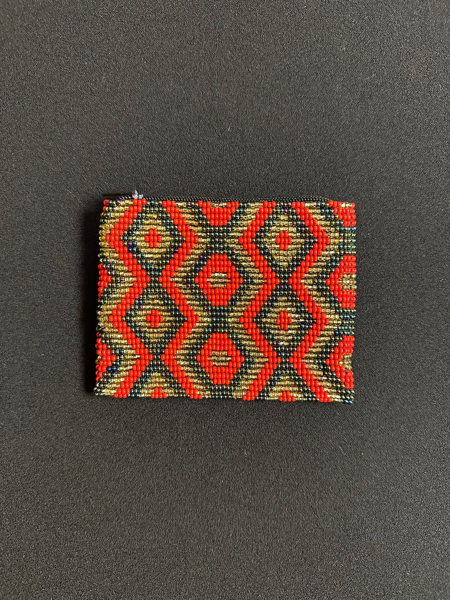 These Guatemalan Hand Beaded Coin Purses are a handcrafted piece of art. Handmade with beads, each purse is lined with a silky nylon lining and closes with a zip-top closure. They are great for organizing items in your purse or bag, and hold credit cards, IDs, metro passes, and change. Perfect for everyday use.