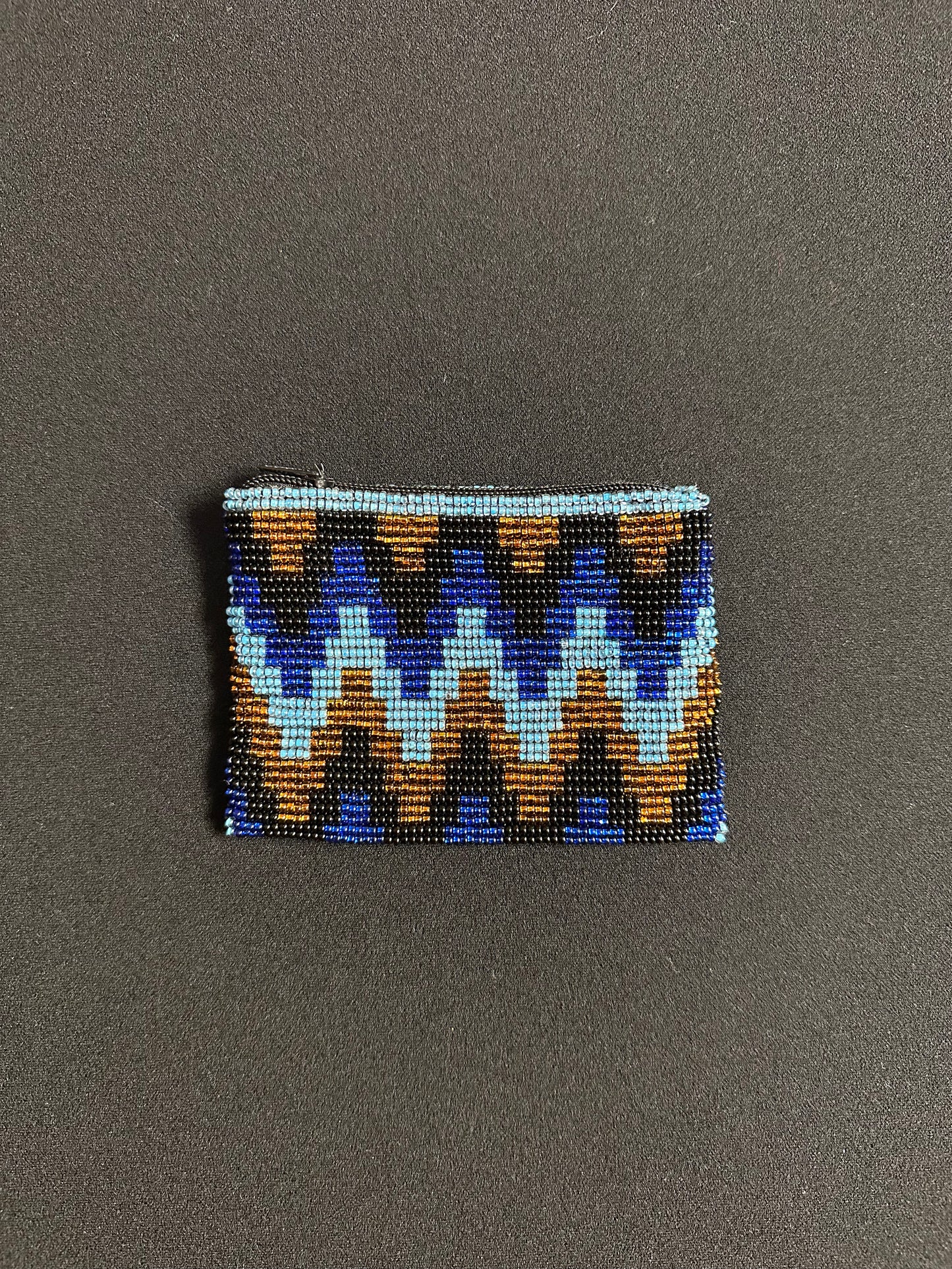 These Guatemalan Hand Beaded Coin Purses are a handcrafted piece of art. Handmade with beads, each purse is lined with a silky nylon lining and closes with a zip-top closure. They are great for organizing items in your purse or bag, and hold credit cards, IDs, metro passes, and change. Perfect for everyday use.