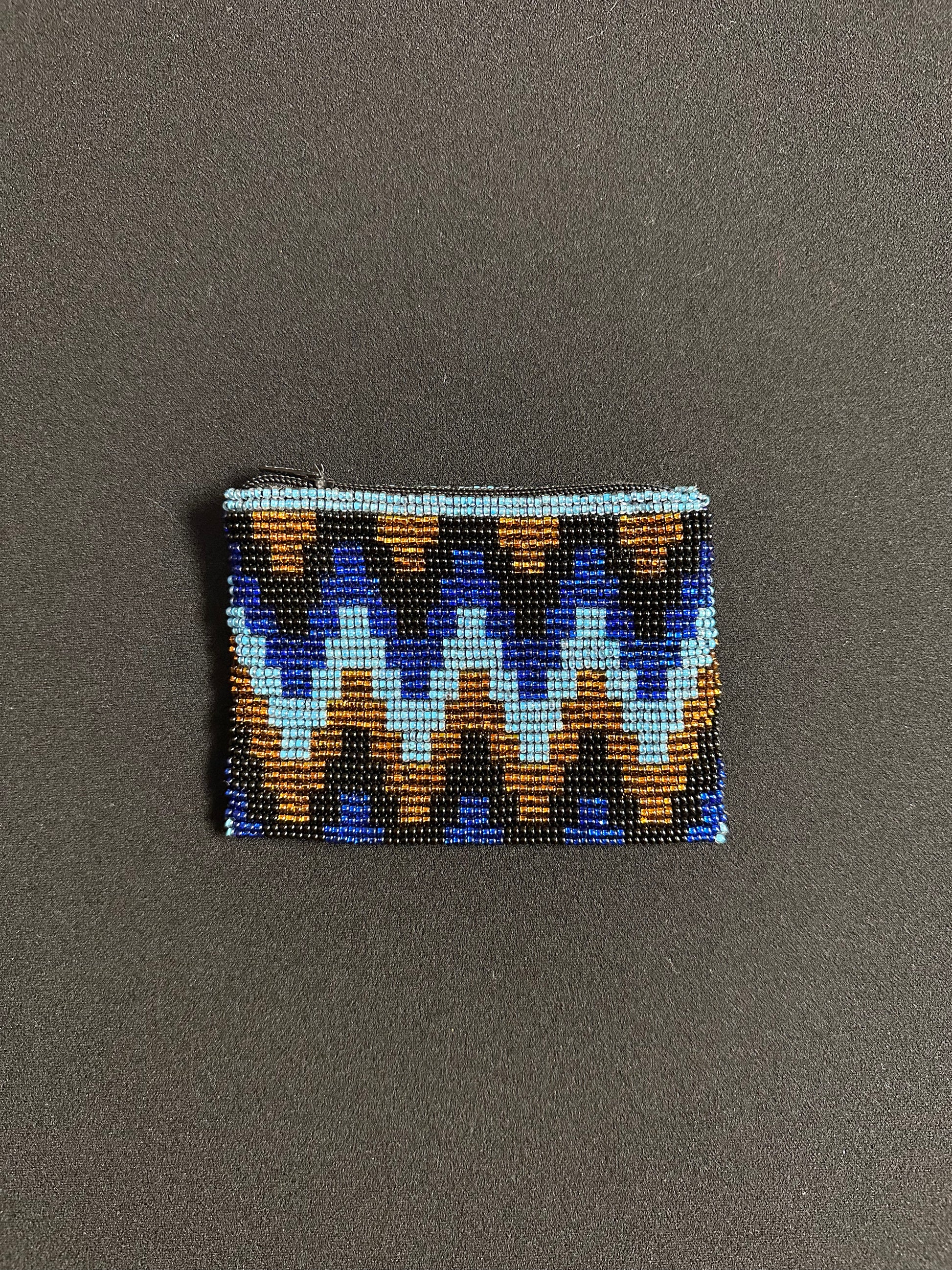 These Guatemalan Hand Beaded Coin Purses are a handcrafted piece of art. Handmade with beads, each purse is lined with a silky nylon lining and closes with a zip-top closure. They are great for organizing items in your purse or bag, and hold credit cards, IDs, metro passes, and change. Perfect for everyday use.