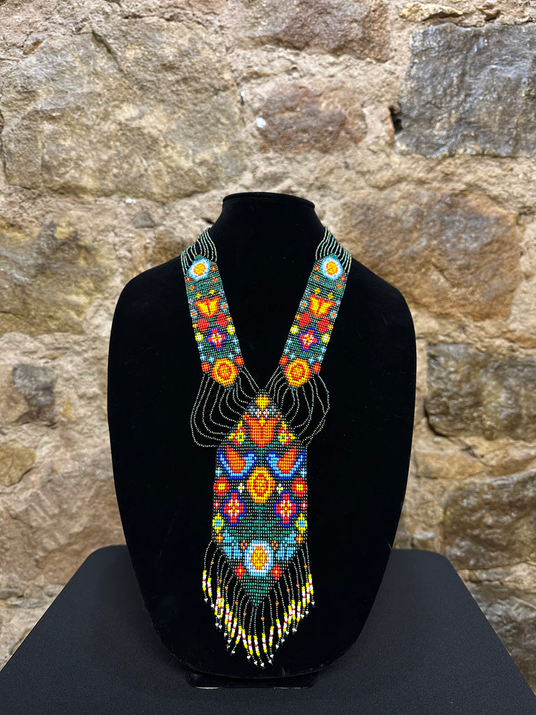 Bring an exotic touch to your look with these stunning beaded necklace motifs. They are all handmade in Guatemala by talented local artisans. Each piece has its own intricate design, creating a truly unique and beautiful piece of jewelry. With a variety of different designs to choose from, you're sure to find one that fits your style perfectly! Show off your one-of-a-kind look by wearing these beautiful Guatemalan hand-made necklace motifs.