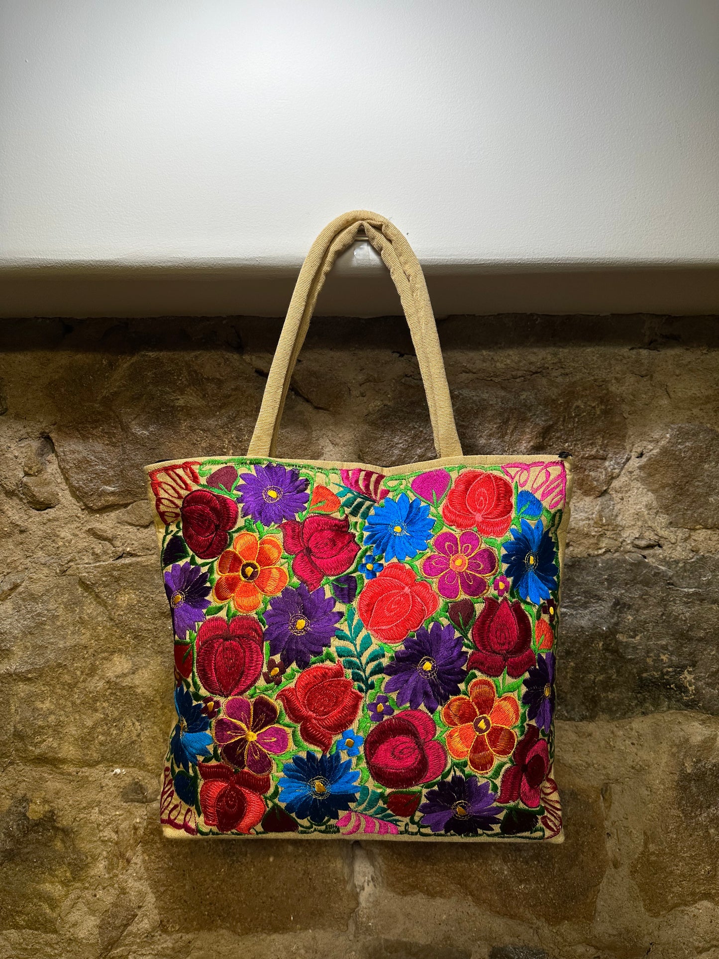 These beautiful embroidered bags can be used for an evening get-together as it can for a day spent shopping with friends. The extraordinary embroidery adds interest and color to any outfit. Roomy, practical and dressy all describe this bag perfectly. The purse has a top zipper, inside liner, two small back pockets with zipper and plenty of room. The embroidery is done in the front of the purse, the back is a solid color. They come in different embroidered designs and colors. 