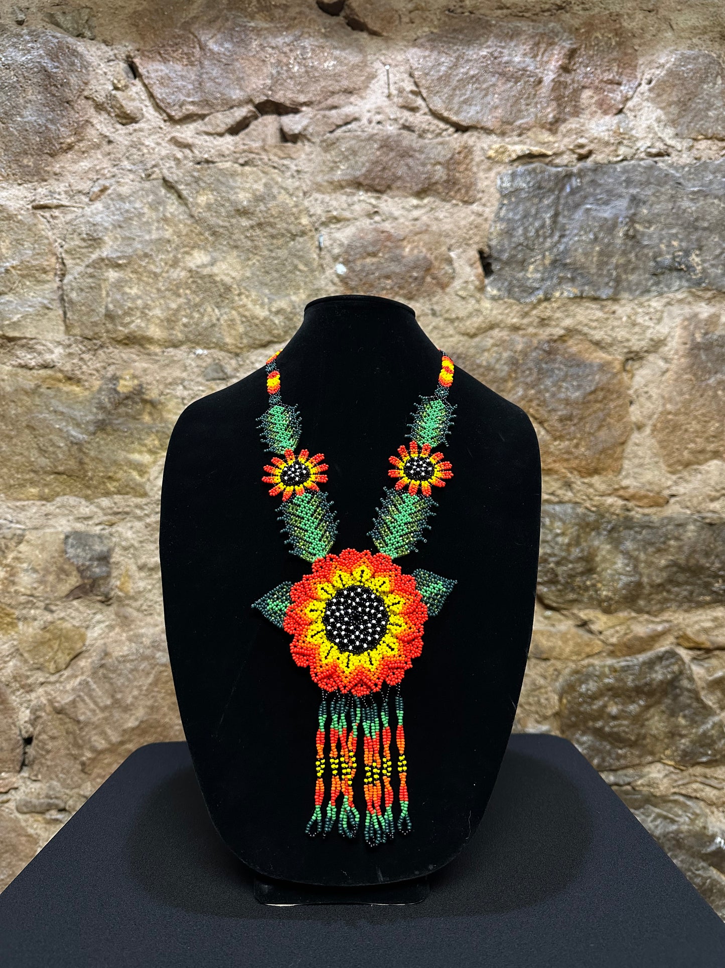 This beautiful and handmade floral beaded necklace is the perfect way to accessorize any outfit. It's colorful beadwork creates a three dimensional stunning flower motif, and you'll love how it brings a touch of fun and cheer to your style. Handcrafted with lots of attention to detail, this beaded necklace is sure to become your favorite accessory!