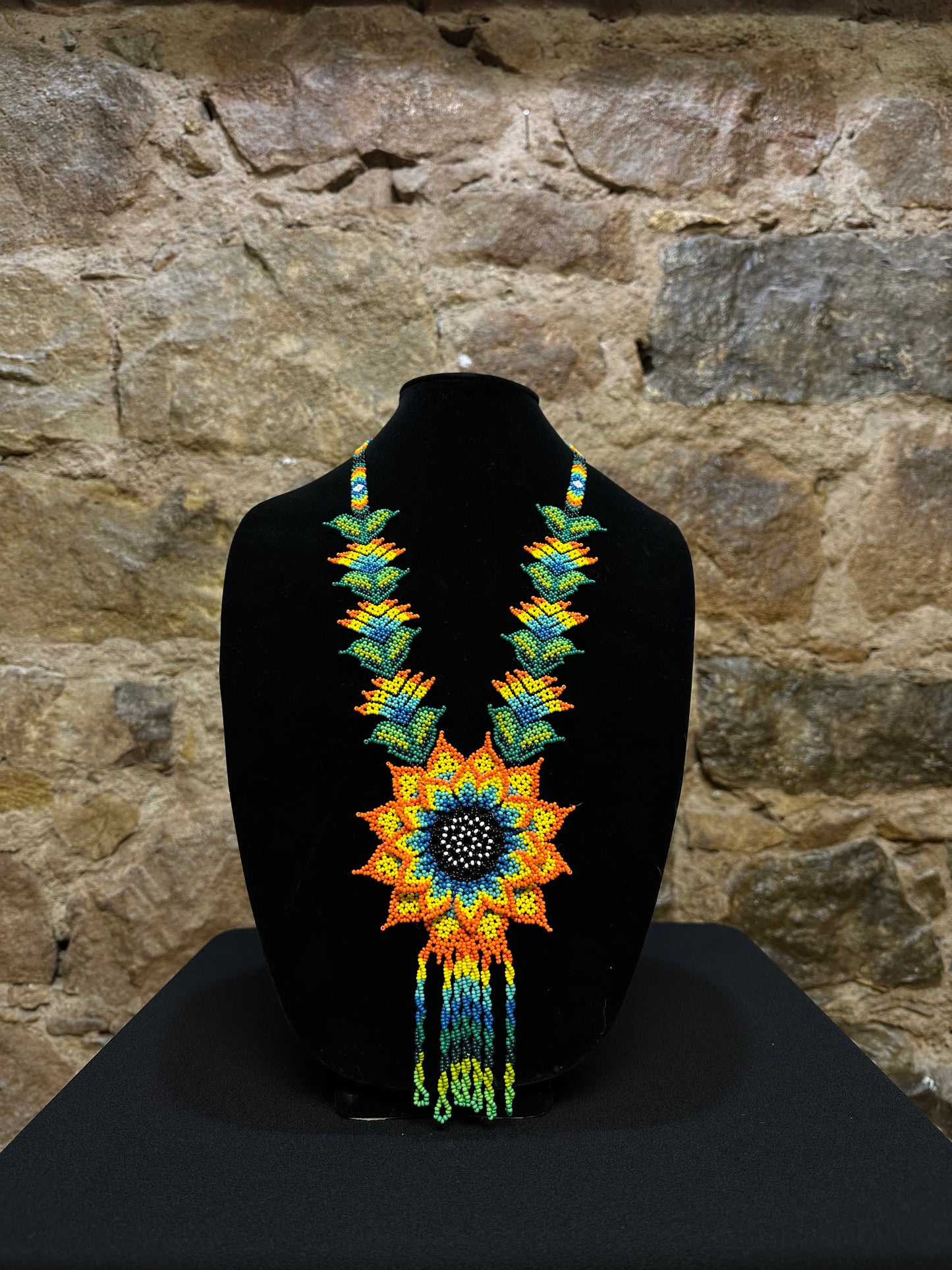 This beautiful and handmade floral beaded necklace is the perfect way to accessorize any outfit. It's colorful beadwork creates a three dimensional stunning flower motif, and you'll love how it brings a touch of fun and cheer to your style. Handcrafted with lots of attention to detail, this beaded necklace is sure to become your favorite accessory!