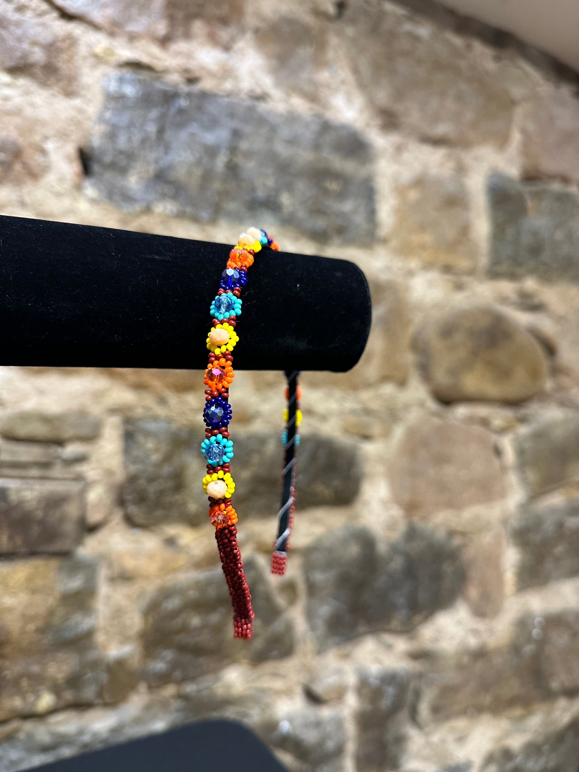 Add a burst of color to your Child's day with these cheerful floral design beaded headbands! All of these headbands are hand made with colorful beads and intricate detail, making them a perfect addition to your child's wardrobe. Ideal for children ages 5 and up, these beaded headbands will become your child's favorite accessory, adding a unique and fun flair to their look!