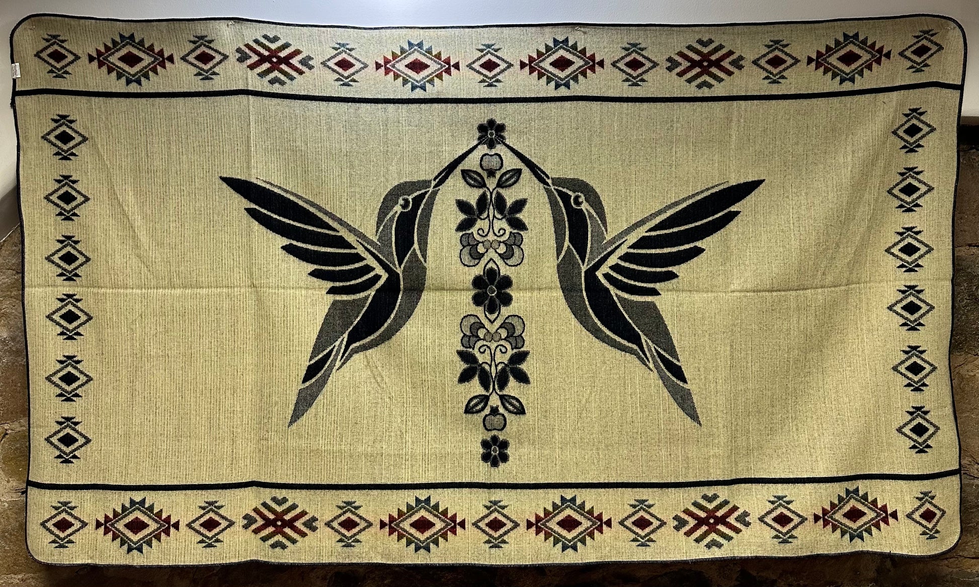 This cozy hummingbird blanket, made in Ecuador, is perfect for snuggling up this winter season! It's soft with a blend of 70% wool and 30% acrylic, keeping you warm and snug wherever you go. Whether you’re cuddling on the sofa, joining a campfire, or just taking an evening stroll, the hummingbird blanket will be the perfect companion and make the experience so much more enjoyable. With its unique design and delicate touch, this fun and festive blanket is sure to be the perfect addition to your home.