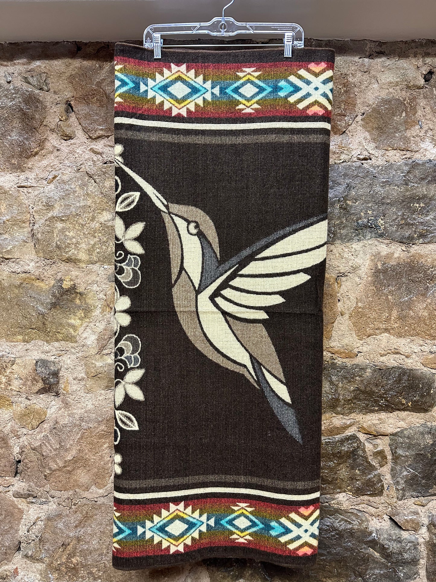 This cozy hummingbird blanket, made in Ecuador, is perfect for snuggling up this winter season! It's soft with a blend of 70% wool and 30% acrylic, keeping you warm and snug wherever you go. Whether you’re cuddling on the sofa, joining a campfire, or just taking an evening stroll, the hummingbird blanket will be the perfect companion and make the experience so much more enjoyable. With its unique design and delicate touch, this fun and festive blanket is sure to be the perfect addition to your home.