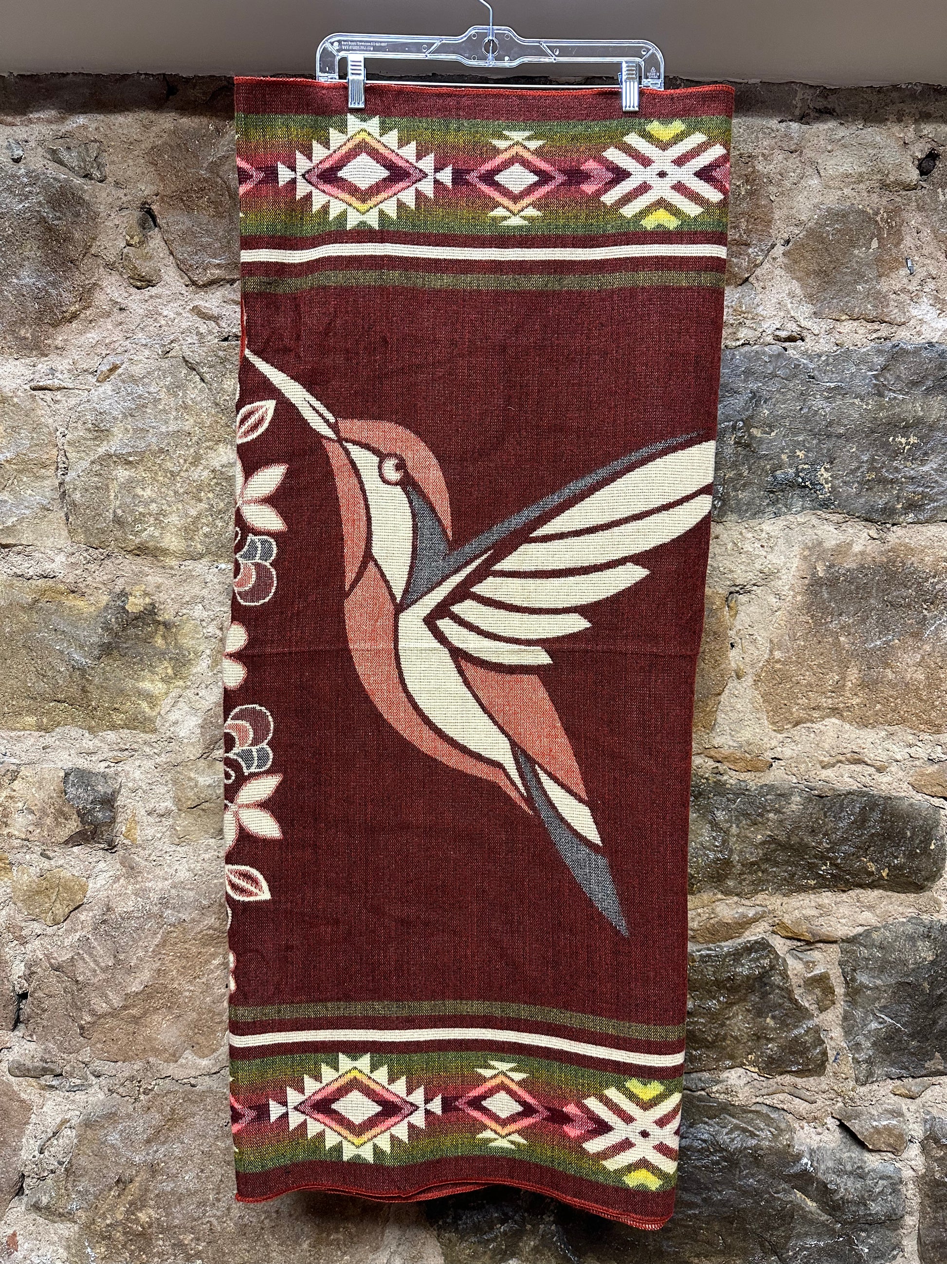 This cozy hummingbird blanket, made in Ecuador, is perfect for snuggling up this winter season! It's soft with a blend of 70% wool and 30% acrylic, keeping you warm and snug wherever you go. Whether you’re cuddling on the sofa, joining a campfire, or just taking an evening stroll, the hummingbird blanket will be the perfect companion and make the experience so much more enjoyable. With its unique design and delicate touch, this fun and festive blanket is sure to be the perfect addition to your home.