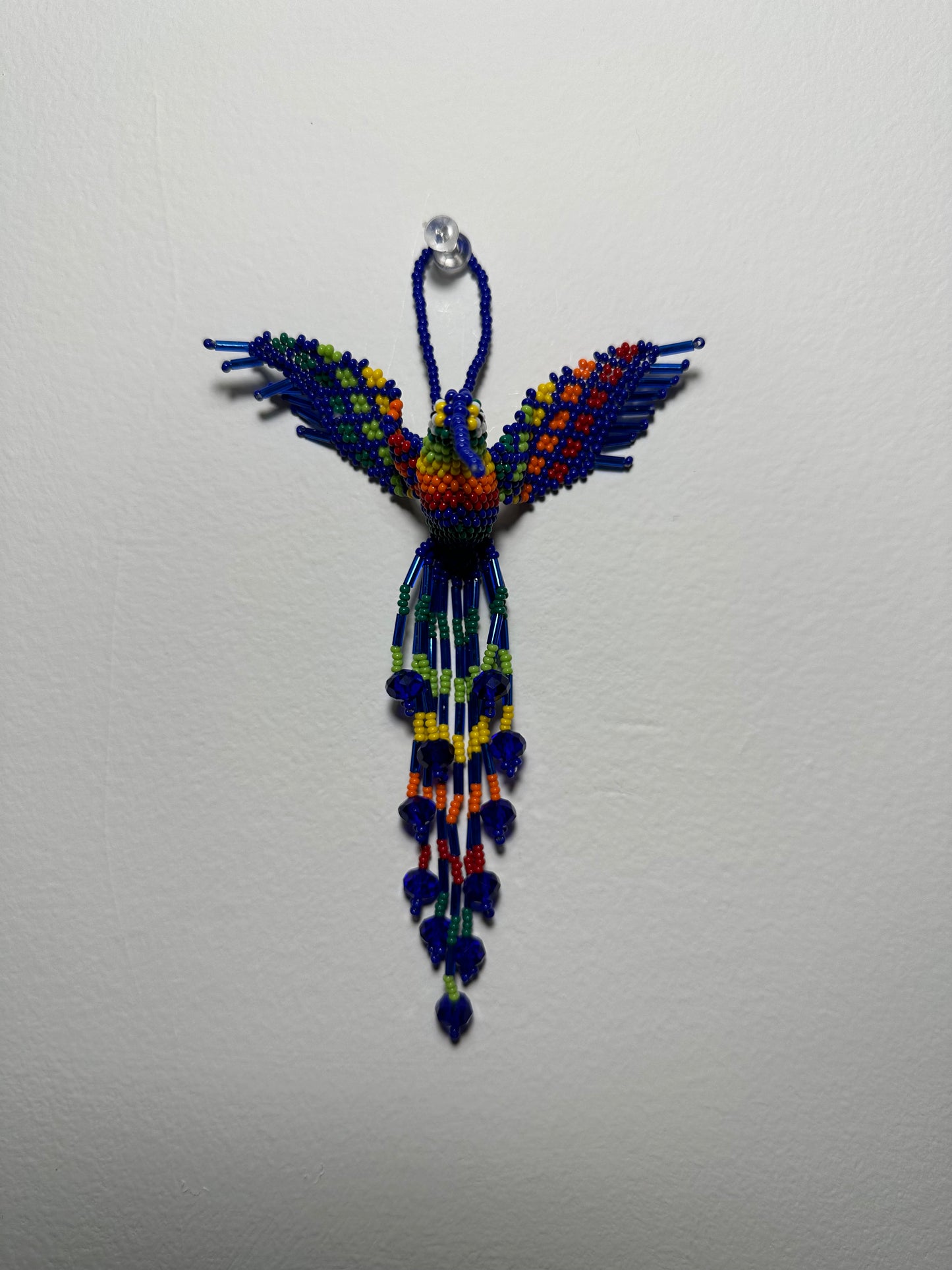 The Humming Bird Beaded Key Chain is something extra special that you won't find anywhere else. Hand Made in Guatemala and decorated with beautiful, multicolored beads, this keychain is unlike any other. Each piece is completely unique and comes in a variety of different colors, ensuring that you can find the perfect accessory to match your style.