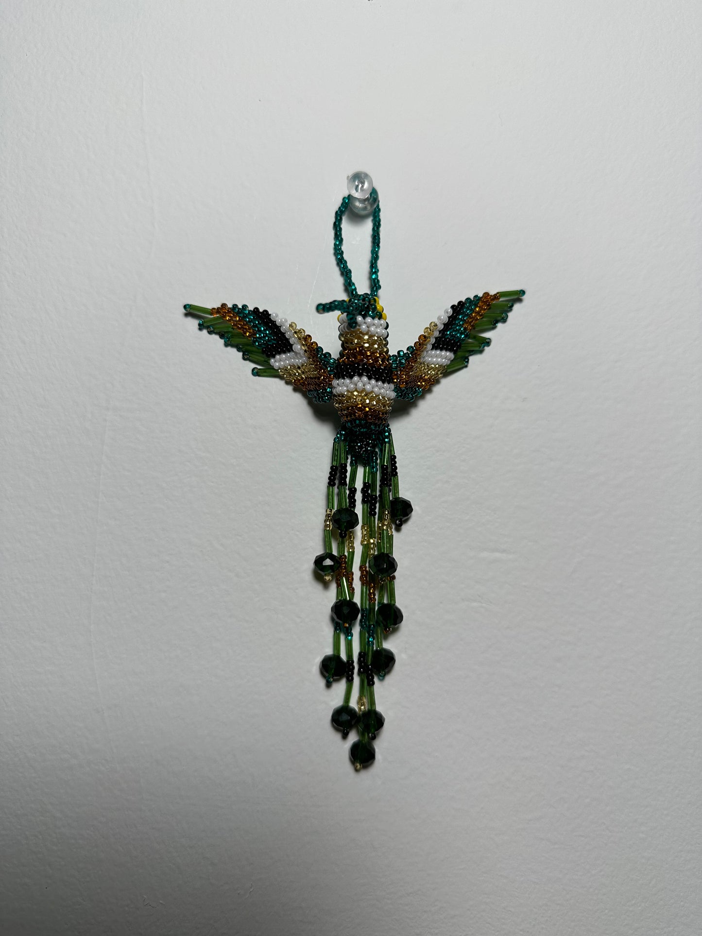 The Humming Bird Beaded Key Chain is something extra special that you won't find anywhere else. Hand Made in Guatemala and decorated with beautiful, multicolored beads, this keychain is unlike any other. Each piece is completely unique and comes in a variety of different colors, ensuring that you can find the perfect accessory to match your style.