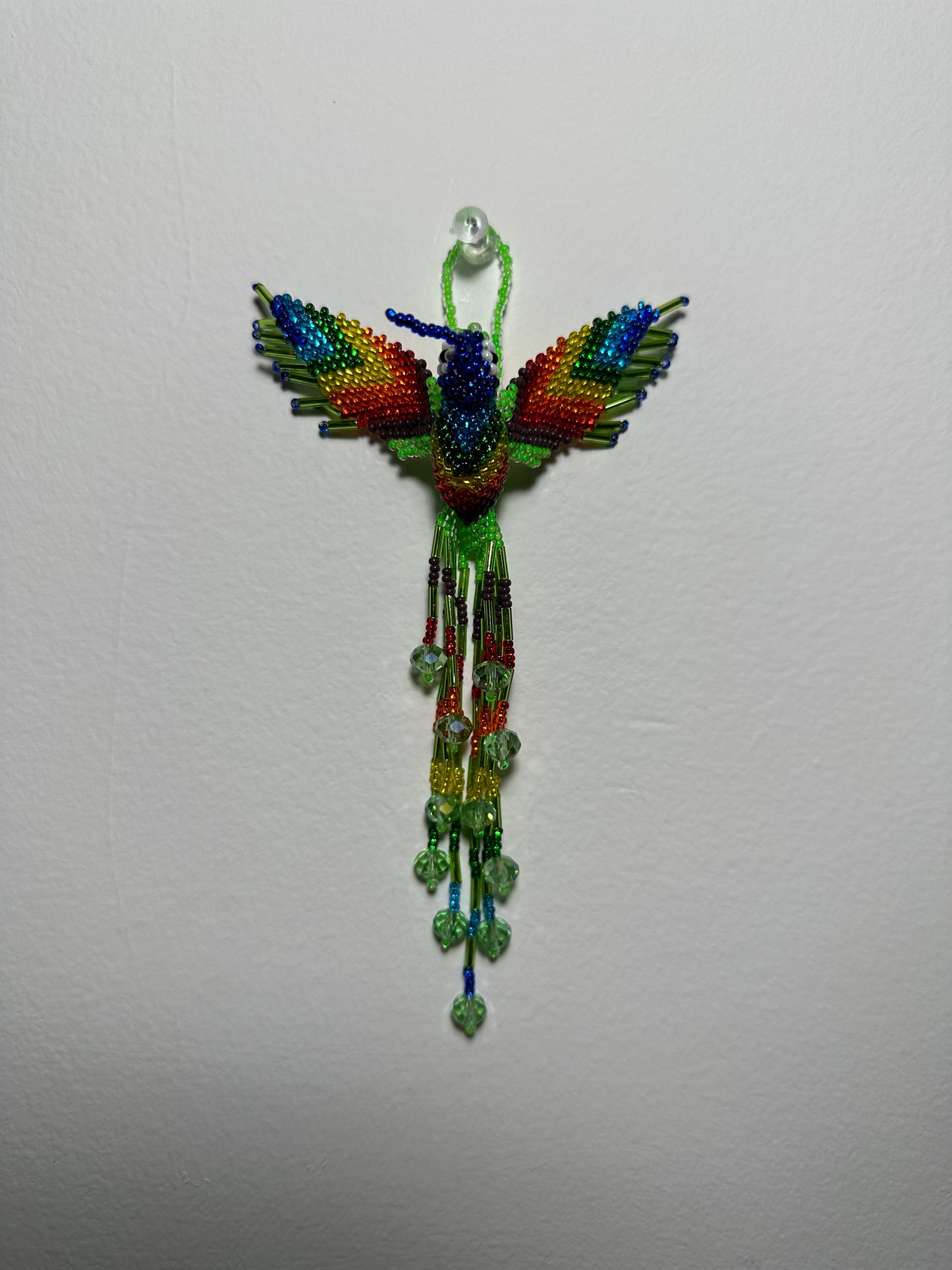 The Humming Bird Beaded Key Chain is something extra special that you won't find anywhere else. Hand Made in Guatemala and decorated with beautiful, multicolored beads, this keychain is unlike any other. Each piece is completely unique and comes in a variety of different colors, ensuring that you can find the perfect accessory to match your style.