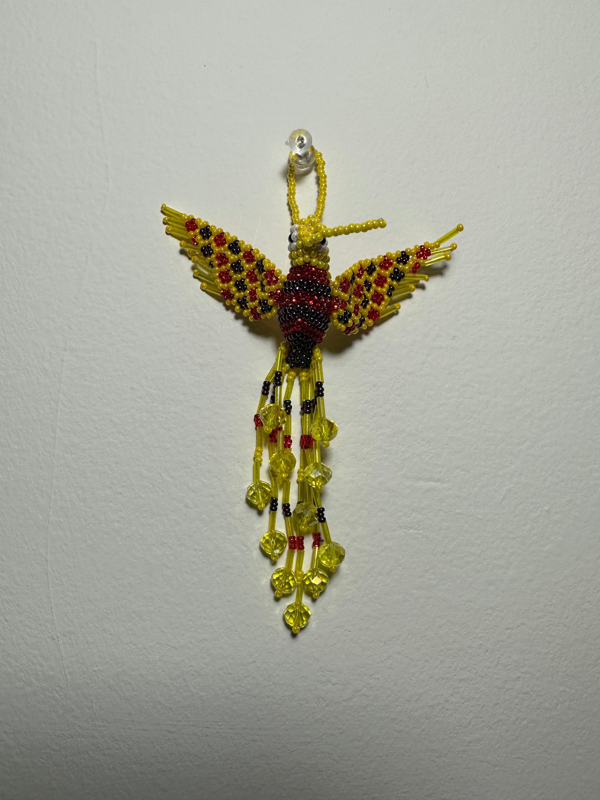 The Humming Bird Beaded Key Chain is something extra special that you won't find anywhere else. Hand Made in Guatemala and decorated with beautiful, multicolored beads, this keychain is unlike any other. Each piece is completely unique and comes in a variety of different colors, ensuring that you can find the perfect accessory to match your style.