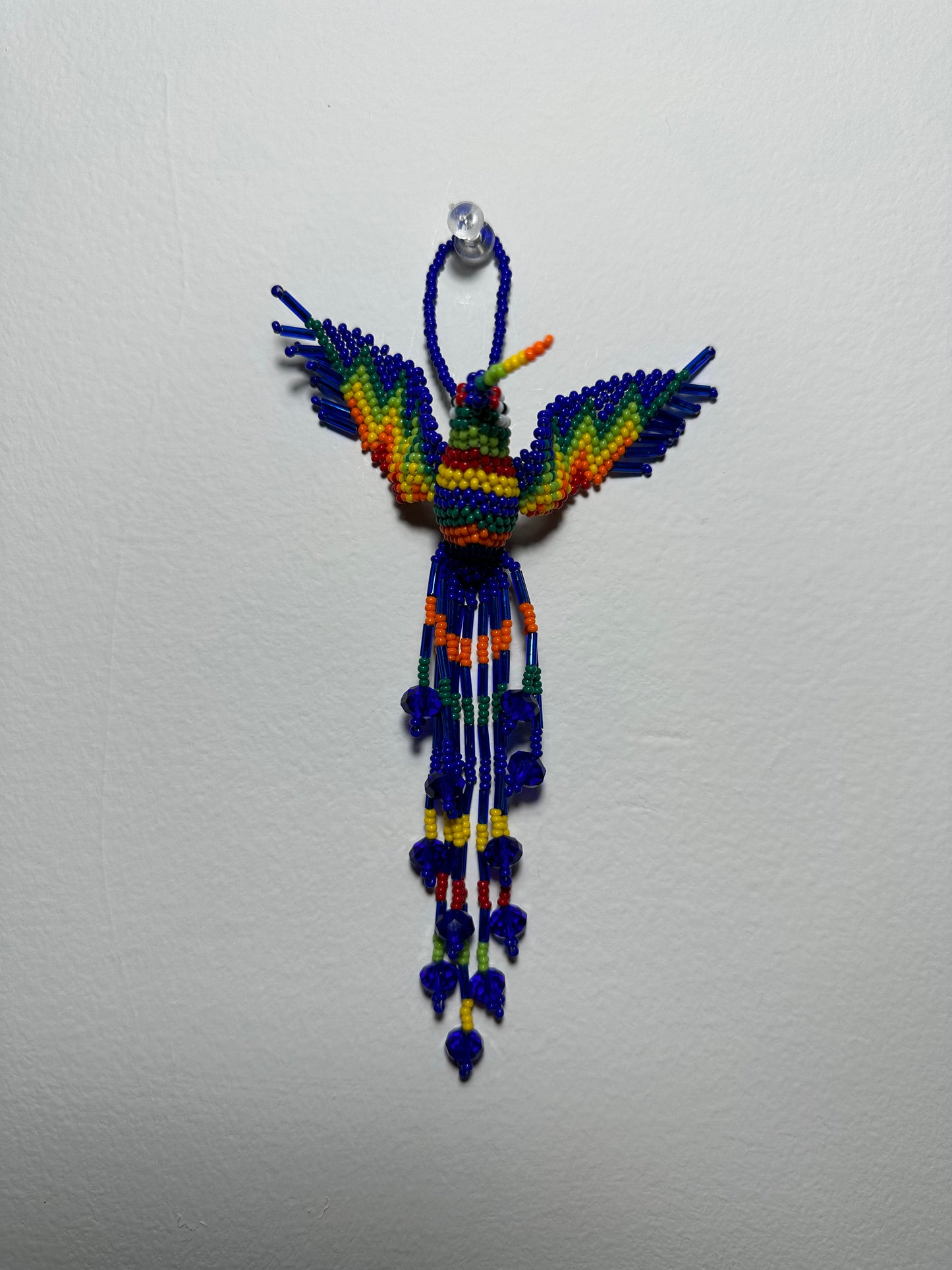 The Humming Bird Beaded Key Chain is something extra special that you won't find anywhere else. Hand Made in Guatemala and decorated with beautiful, multicolored beads, this keychain is unlike any other. Each piece is completely unique and comes in a variety of different colors, ensuring that you can find the perfect accessory to match your style.