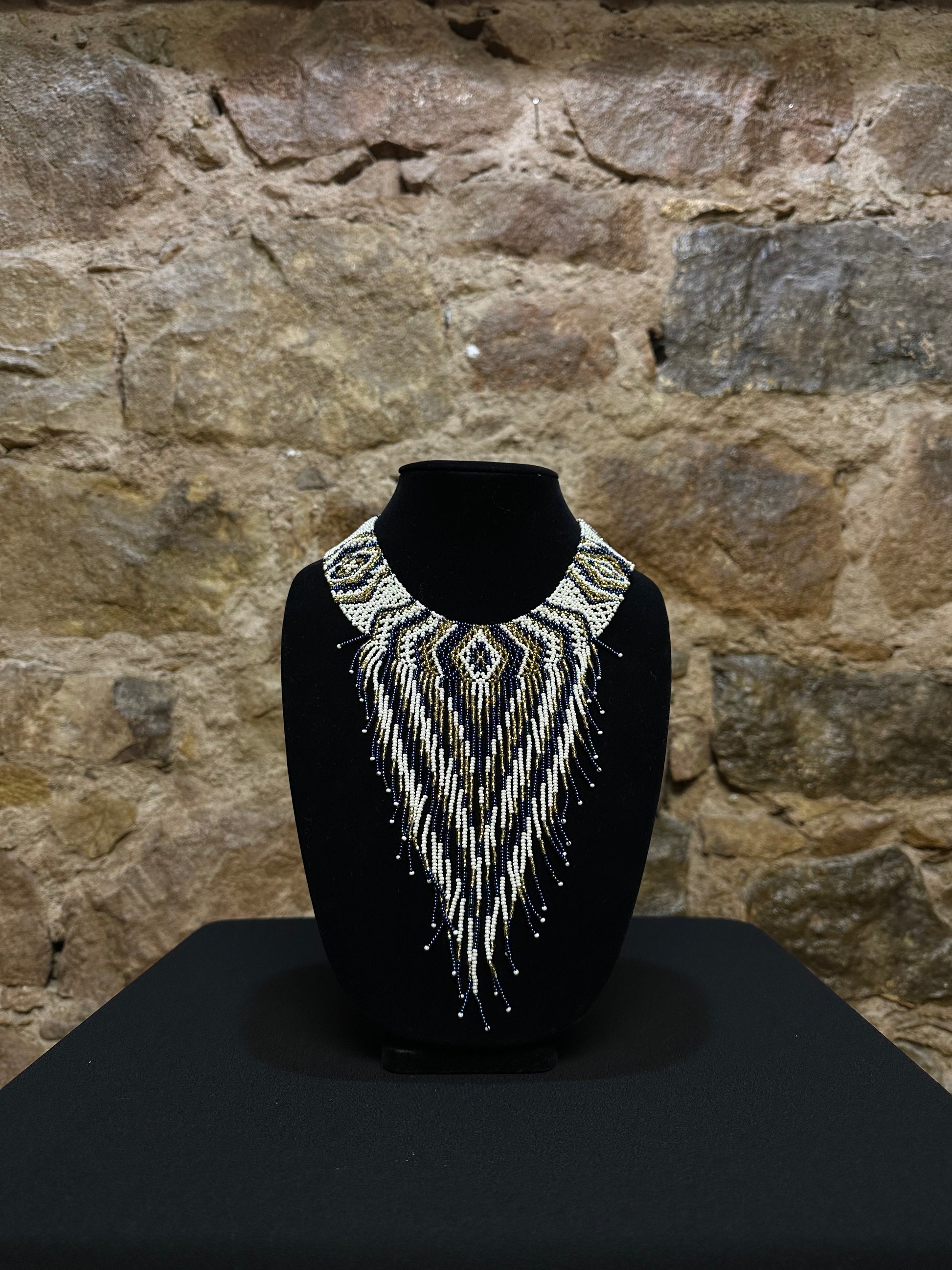  This beautiful Guatemalan-made Waterfall Beaded Necklace will add sparkle and color to any look! The craftsmanship is impeccable, with bright beads in a V-shaped waterfall design. Each piece is hand made with care and adds a unique beauty to any ensemble. Pull your look together with this stunning necklace!