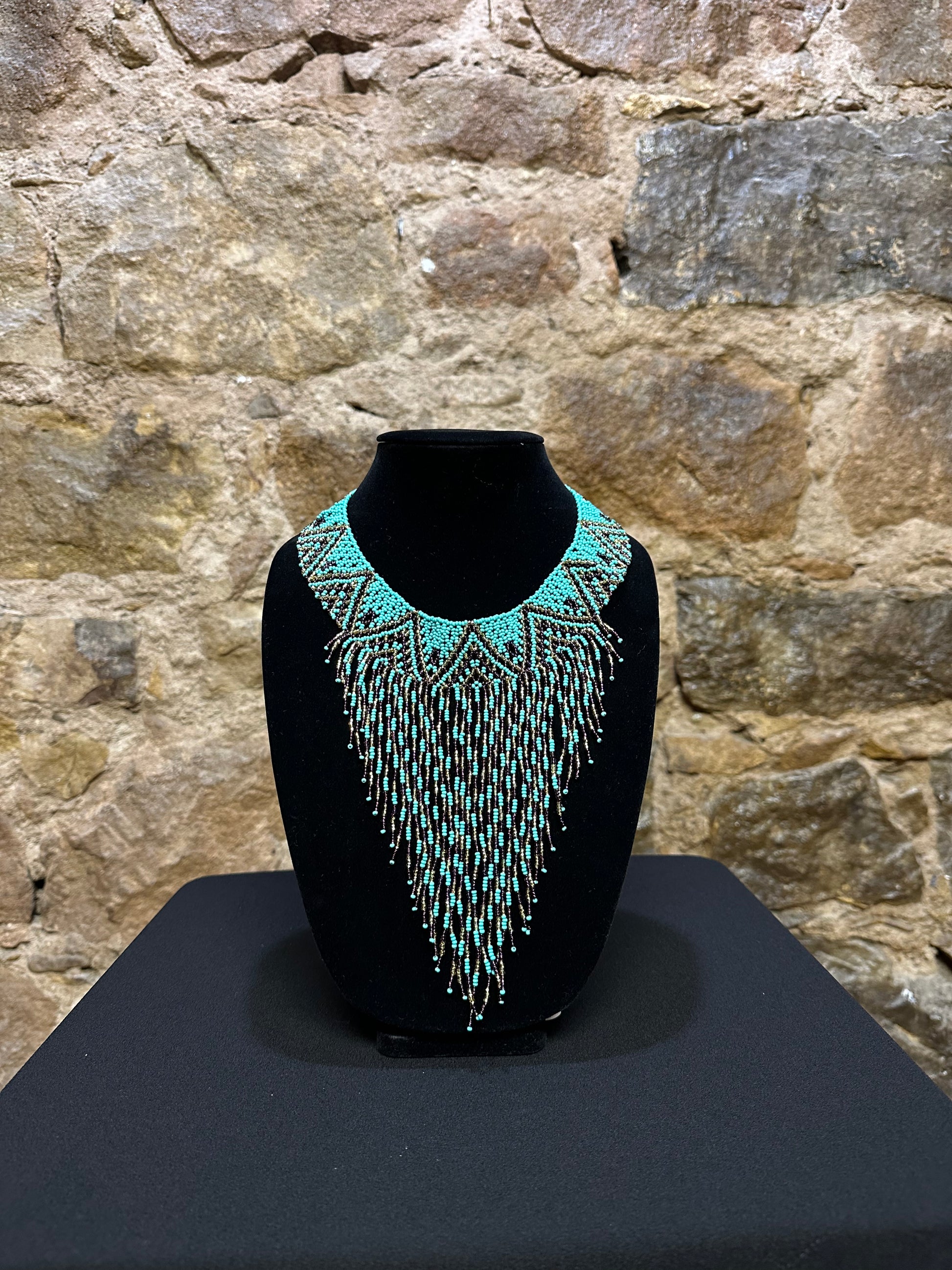 This beautiful Guatemalan-made Waterfall Beaded Necklace will add sparkle and color to any look! The craftsmanship is impeccable, with bright beads in a V-shaped waterfall design. Each piece is hand made with care and adds a unique beauty to any ensemble. Pull your look together with this stunning necklace!