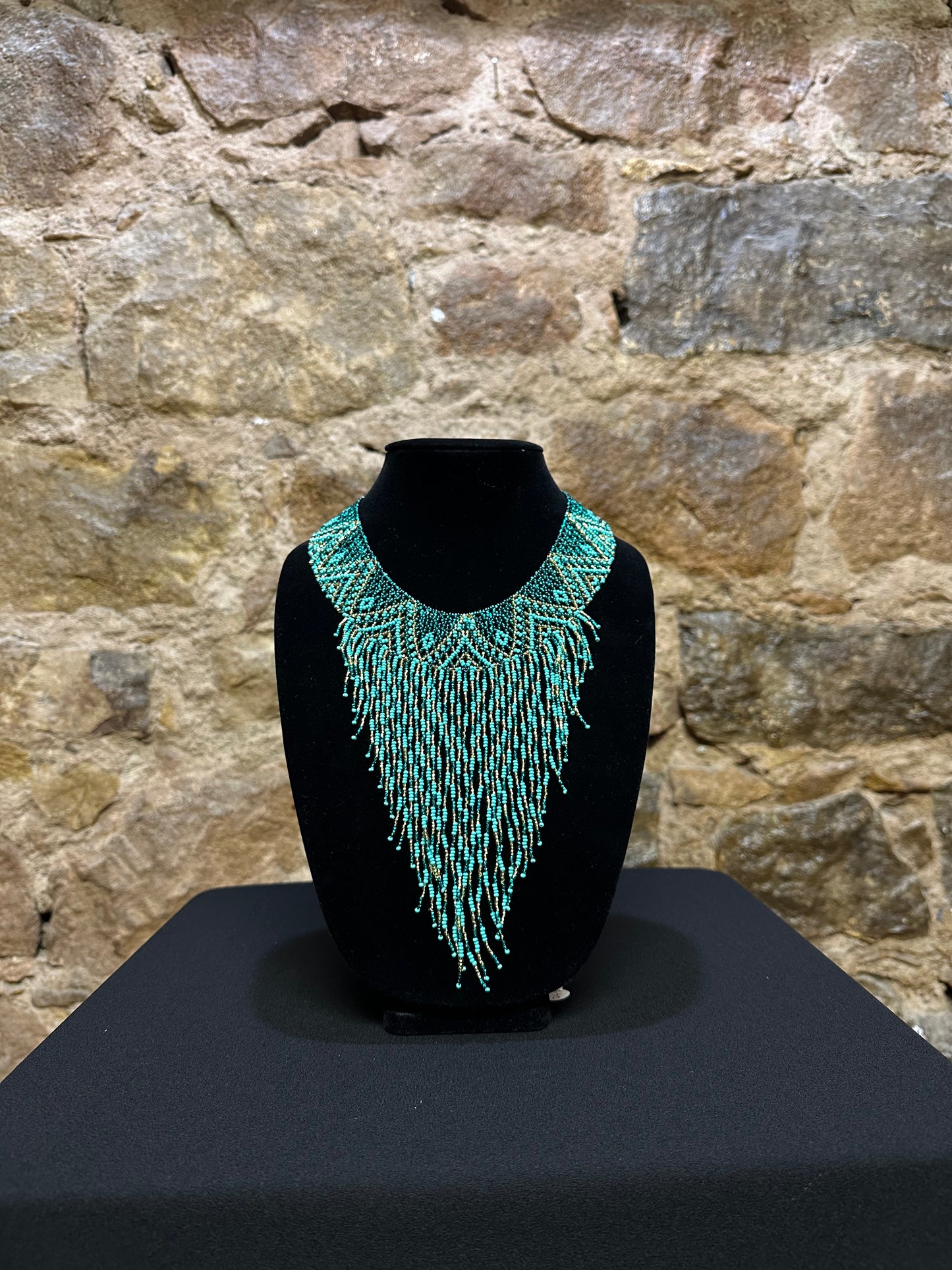 This beautiful Guatemalan-made Waterfall Beaded Necklace will add sparkle and color to any look! The craftsmanship is impeccable, with bright beads in a V-shaped waterfall design. Each piece is hand made with care and adds a unique beauty to any ensemble. Pull your look together with this stunning necklace!