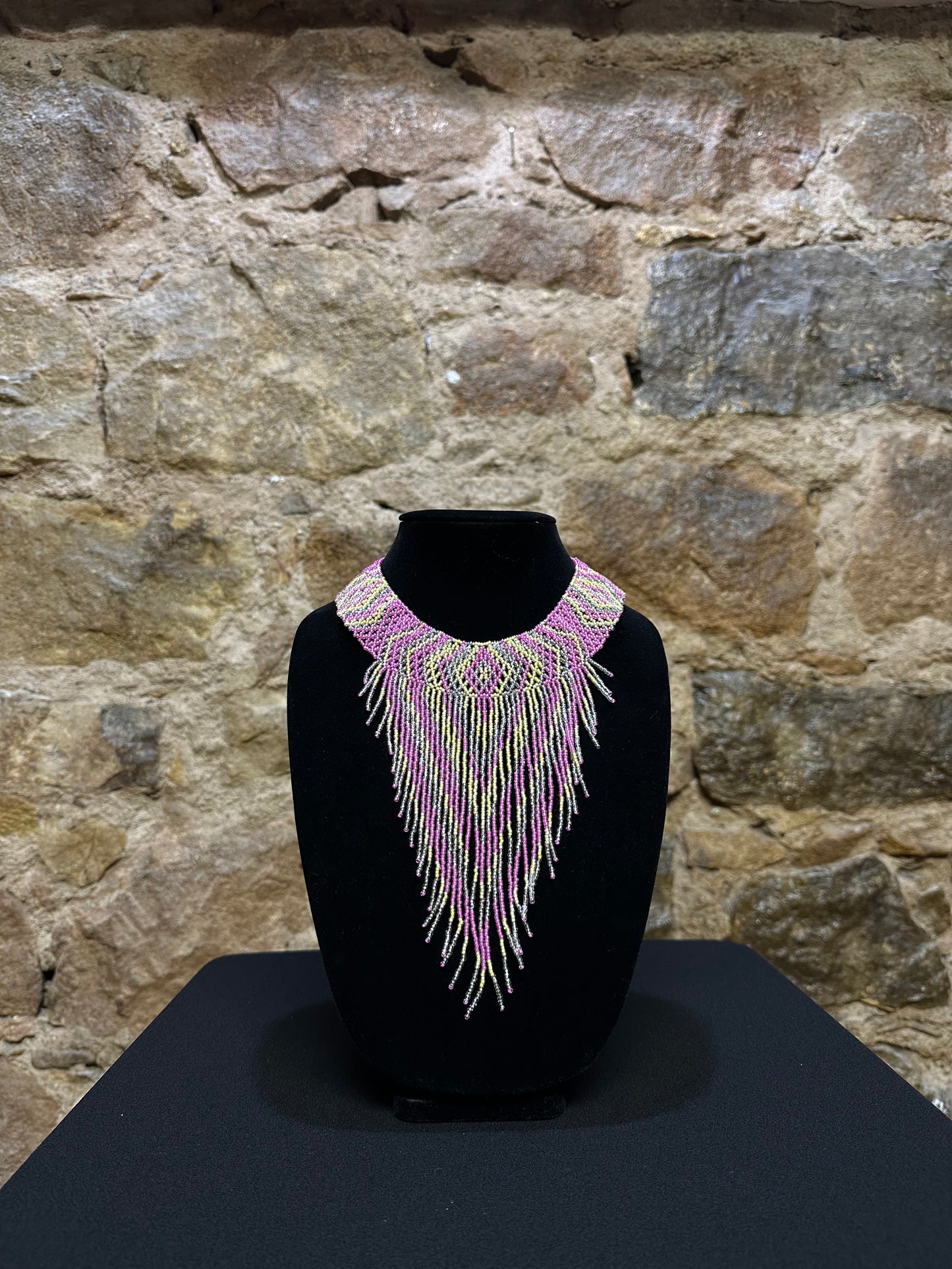 This beautiful Guatemalan-made Waterfall Beaded Necklace will add sparkle and color to any look! The craftsmanship is impeccable, with bright beads in a V-shaped waterfall design. Each piece is hand made with care and adds a unique beauty to any ensemble. Pull your look together with this stunning necklace!