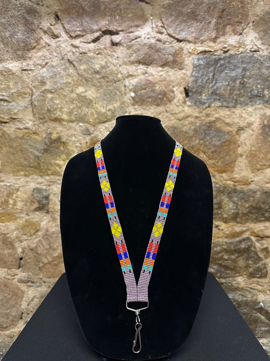 If you're looking for something to keep your keys close at hand, this Guatemalan Hand Made Beaded Key Holder Lanyard is just what you need! Hand made from beautiful Guatemalan beads and exquisitely crafted, this key holder lanyard will add a touch of style and sophistication to any outfit. Plus, it's comfortable to wear and lightweight so you won't even know it's there!