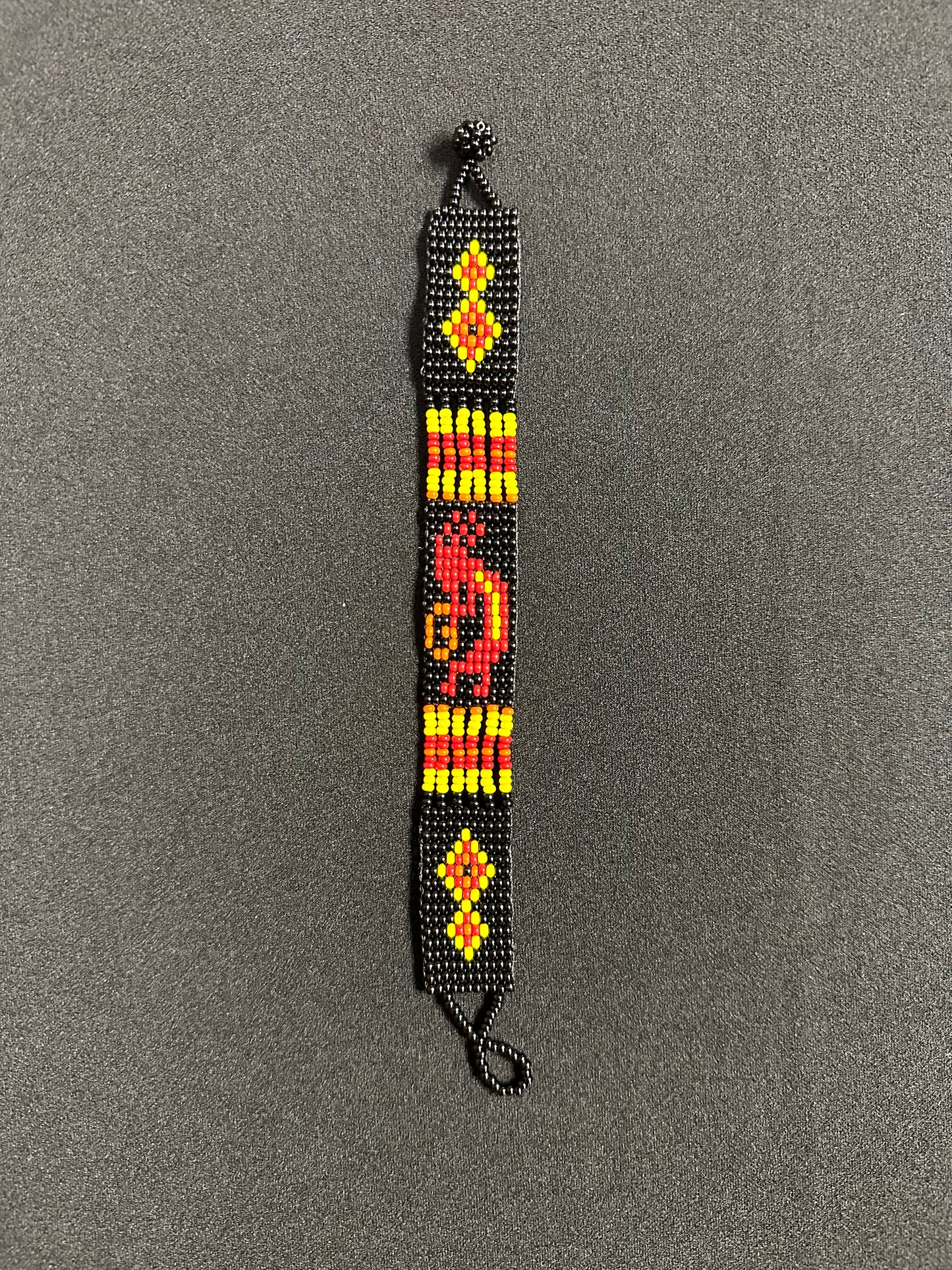 This beautiful hand-made Guatemalan accessory is a great addition to any jewelry collection! The bracelet boasts fun, vibrant colors inspired by the vibrant palette of the native culture. It's sure to turn heads with its unique design and beautiful hues. Add a bit of fun and excitement to your look with the Kokopelli Design Bracelet!