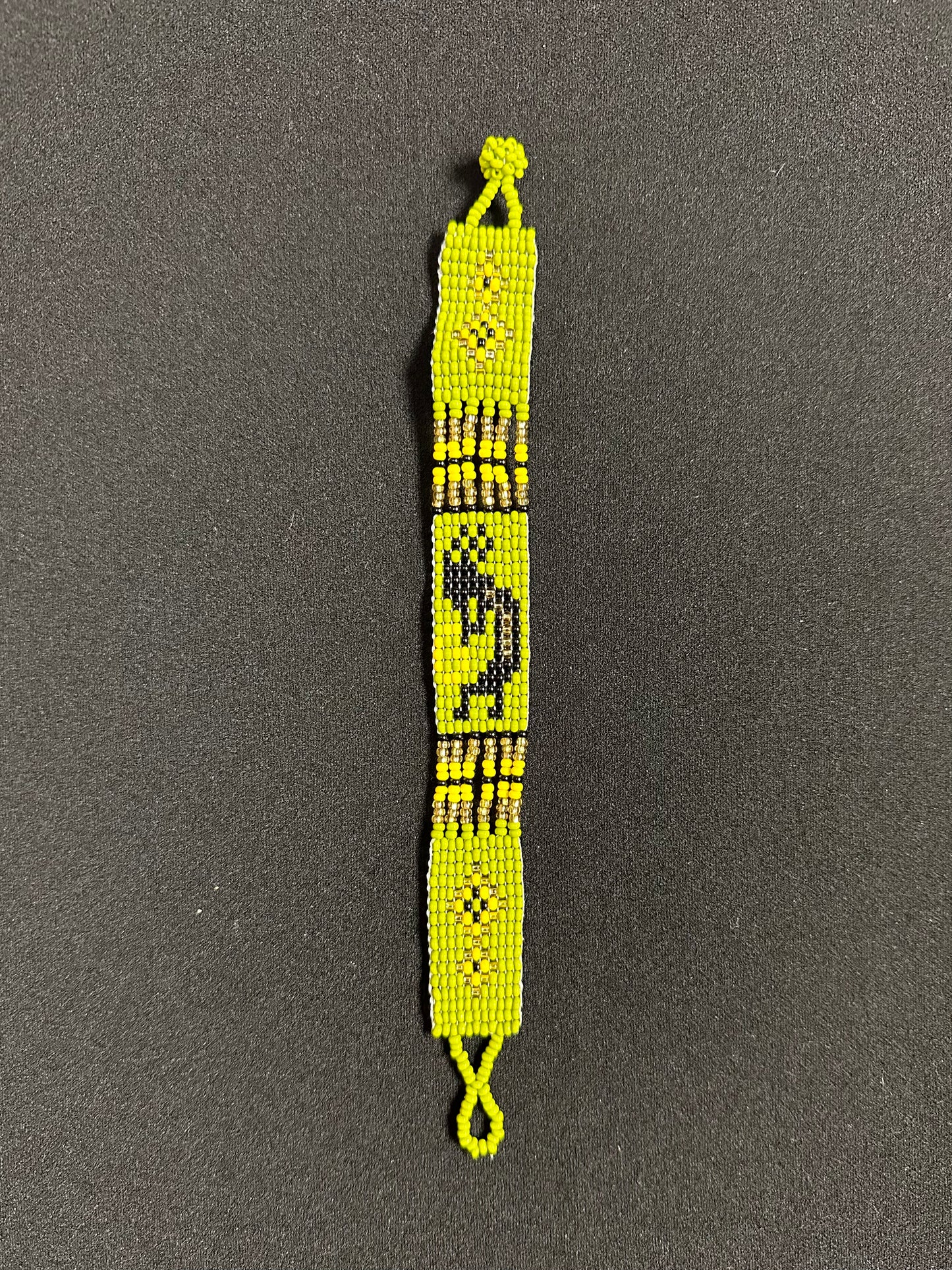 This beautiful hand-made Guatemalan accessory is a great addition to any jewelry collection! The bracelet boasts fun, vibrant colors inspired by the vibrant palette of the native culture. It's sure to turn heads with its unique design and beautiful hues. Add a bit of fun and excitement to your look with the Kokopelli Design Bracelet!