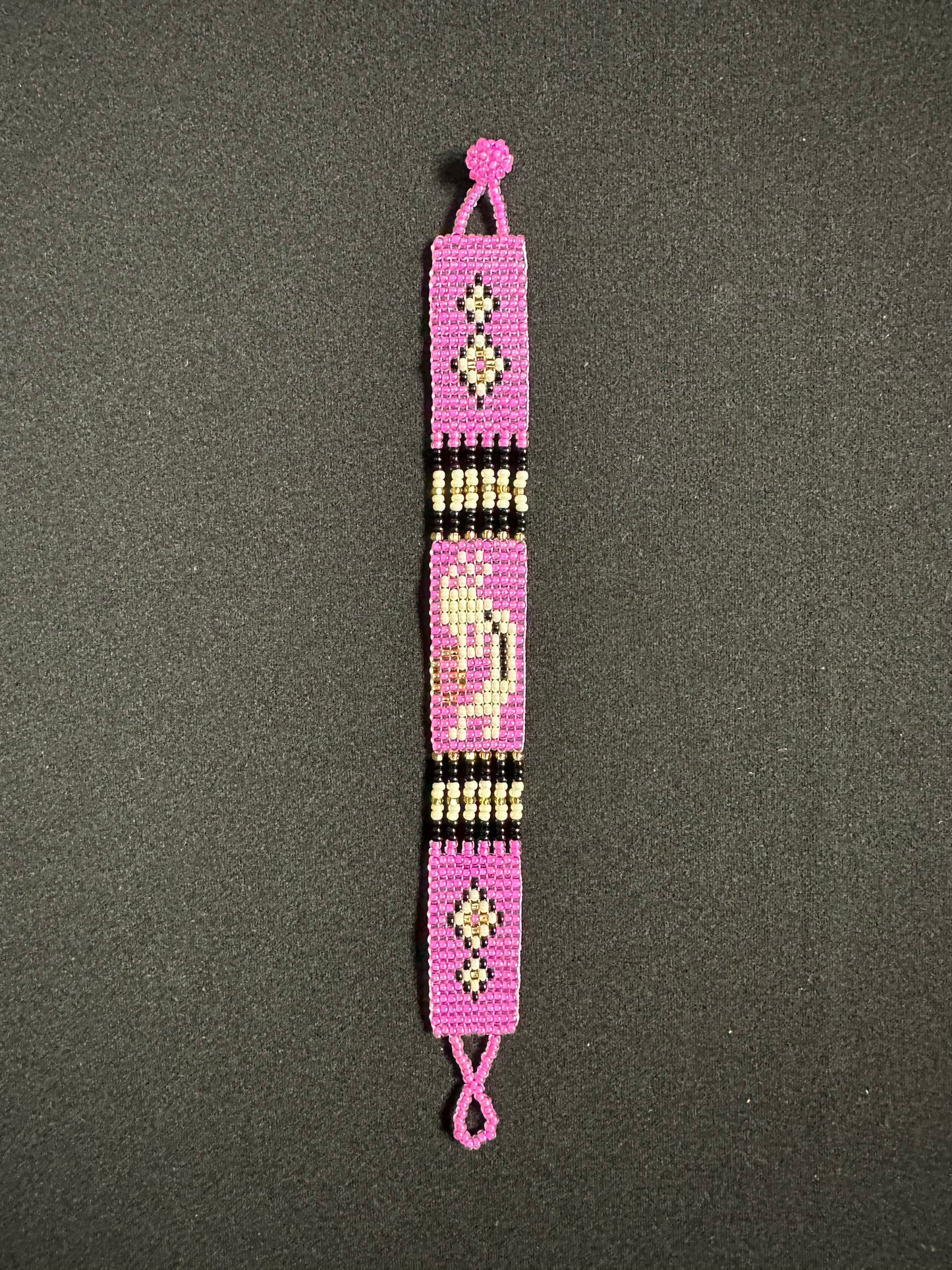 This beautiful hand-made Guatemalan accessory is a great addition to any jewelry collection! The bracelet boasts fun, vibrant colors inspired by the vibrant palette of the native culture. It's sure to turn heads with its unique design and beautiful hues. Add a bit of fun and excitement to your look with the Kokopelli Design Bracelet!