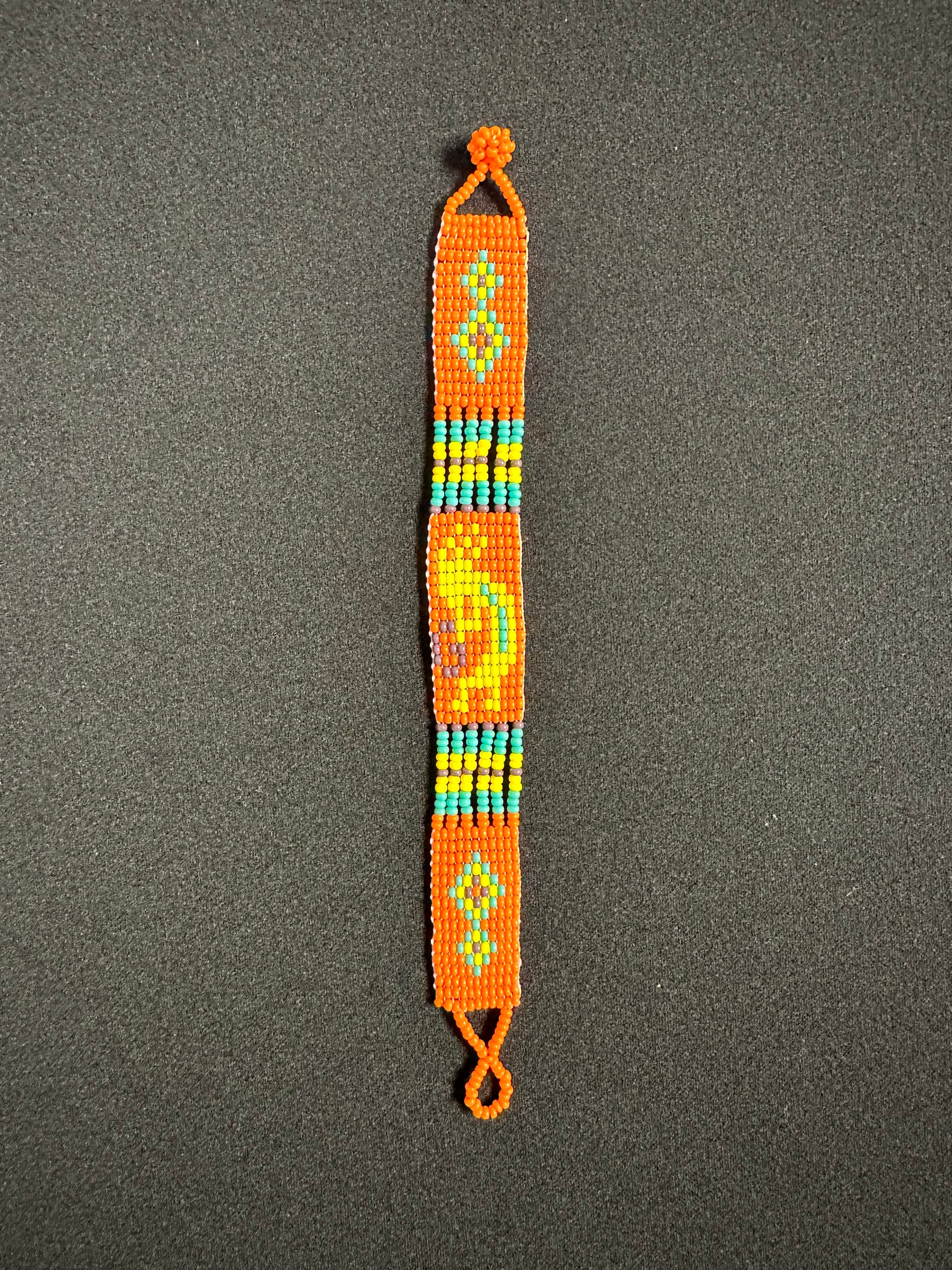 This beautiful hand-made Guatemalan accessory is a great addition to any jewelry collection! The bracelet boasts fun, vibrant colors inspired by the vibrant palette of the native culture. It's sure to turn heads with its unique design and beautiful hues. Add a bit of fun and excitement to your look with the Kokopelli Design Bracelet!