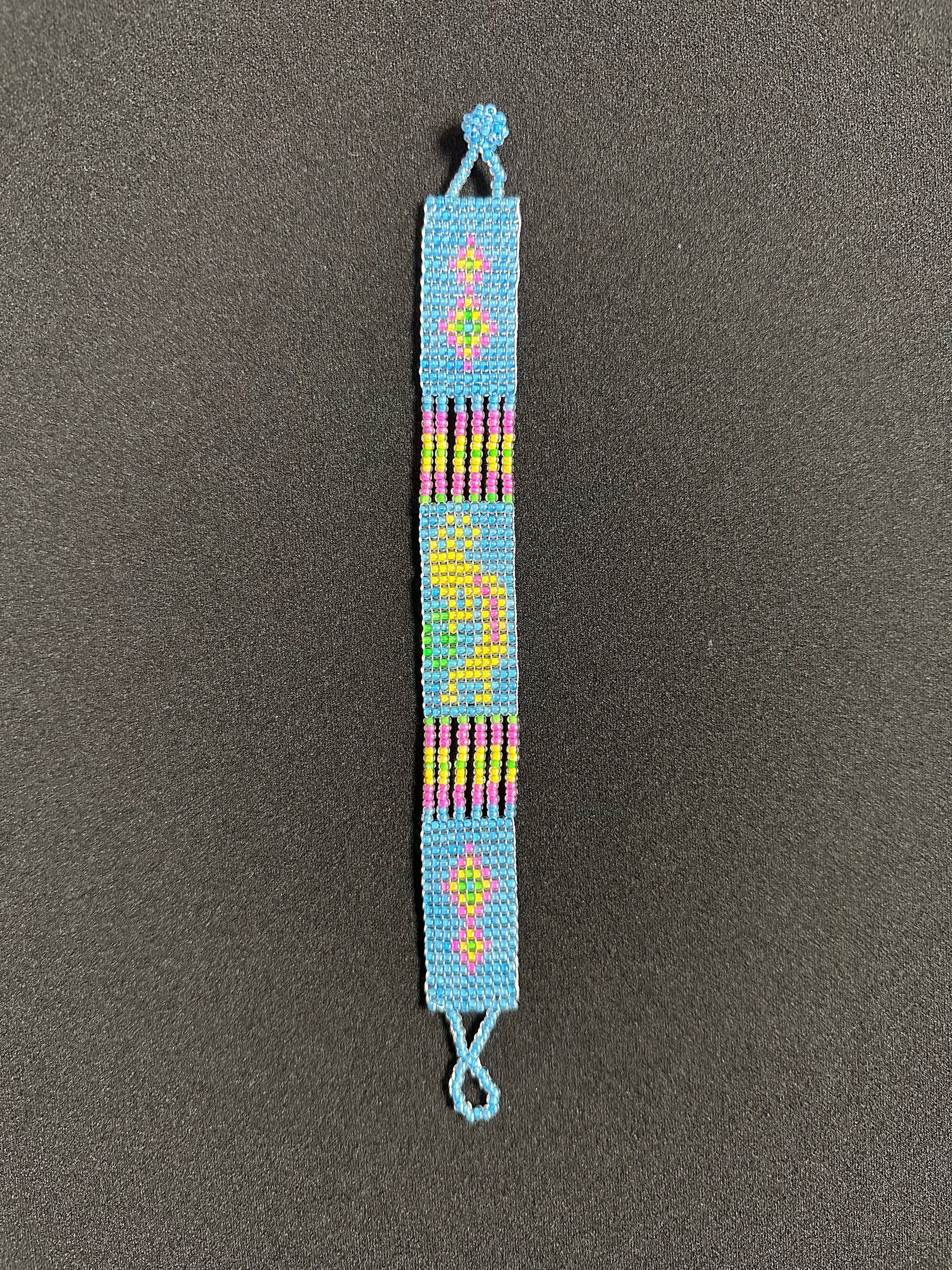 This beautiful hand-made Guatemalan accessory is a great addition to any jewelry collection! The bracelet boasts fun, vibrant colors inspired by the vibrant palette of the native culture. It's sure to turn heads with its unique design and beautiful hues. Add a bit of fun and excitement to your look with the Kokopelli Design Bracelet!