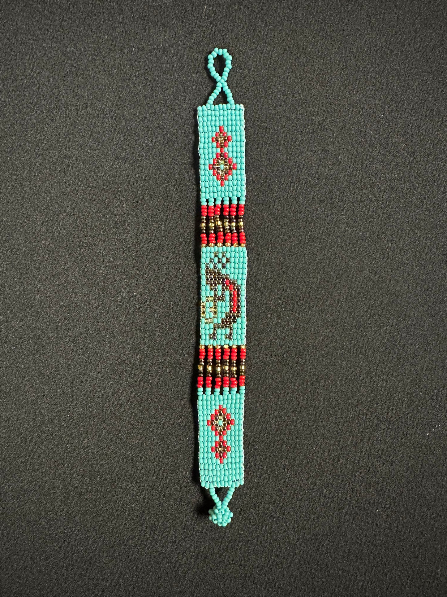 This beautiful hand-made Guatemalan accessory is a great addition to any jewelry collection! The bracelet boasts fun, vibrant colors inspired by the vibrant palette of the native culture. It's sure to turn heads with its unique design and beautiful hues. Add a bit of fun and excitement to your look with the Kokopelli Design Bracelet!