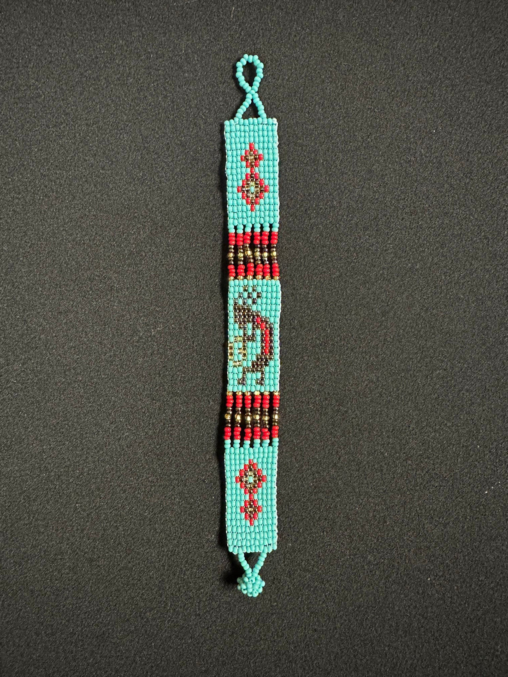 This beautiful hand-made Guatemalan accessory is a great addition to any jewelry collection! The bracelet boasts fun, vibrant colors inspired by the vibrant palette of the native culture. It's sure to turn heads with its unique design and beautiful hues. Add a bit of fun and excitement to your look with the Kokopelli Design Bracelet!