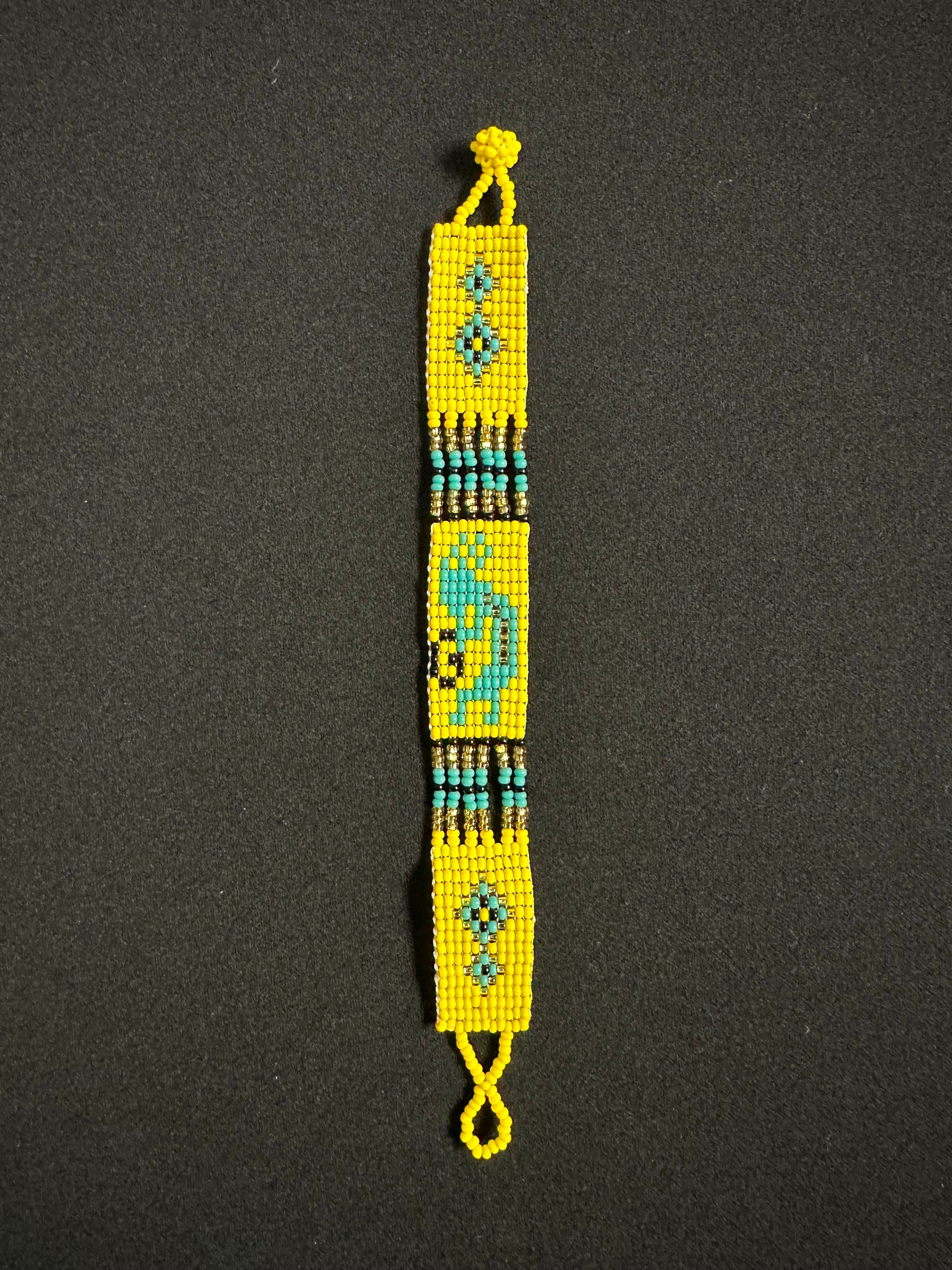 This beautiful hand-made Guatemalan accessory is a great addition to any jewelry collection! The bracelet boasts fun, vibrant colors inspired by the vibrant palette of the native culture. It's sure to turn heads with its unique design and beautiful hues. Add a bit of fun and excitement to your look with the Kokopelli Design Bracelet!