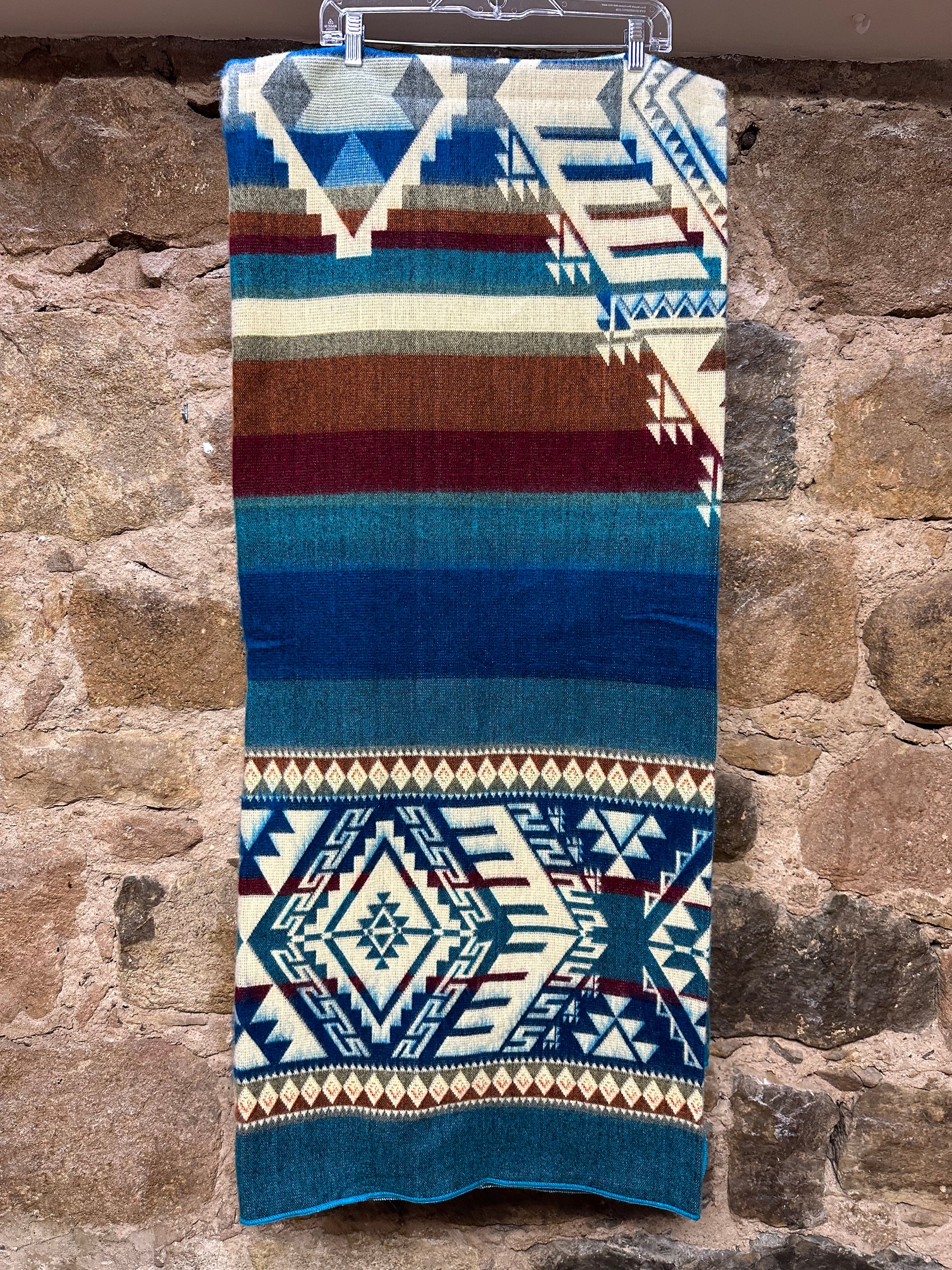 Kick back and cozy up with a blanket softer than anything you’ve ever experienced before. This vibrant, unique piece adds envy-worthy style to any room, while also being tough enough to withstand the wear and tear of constant use. Handmade by artisans in Ecuador. Reversible Color.