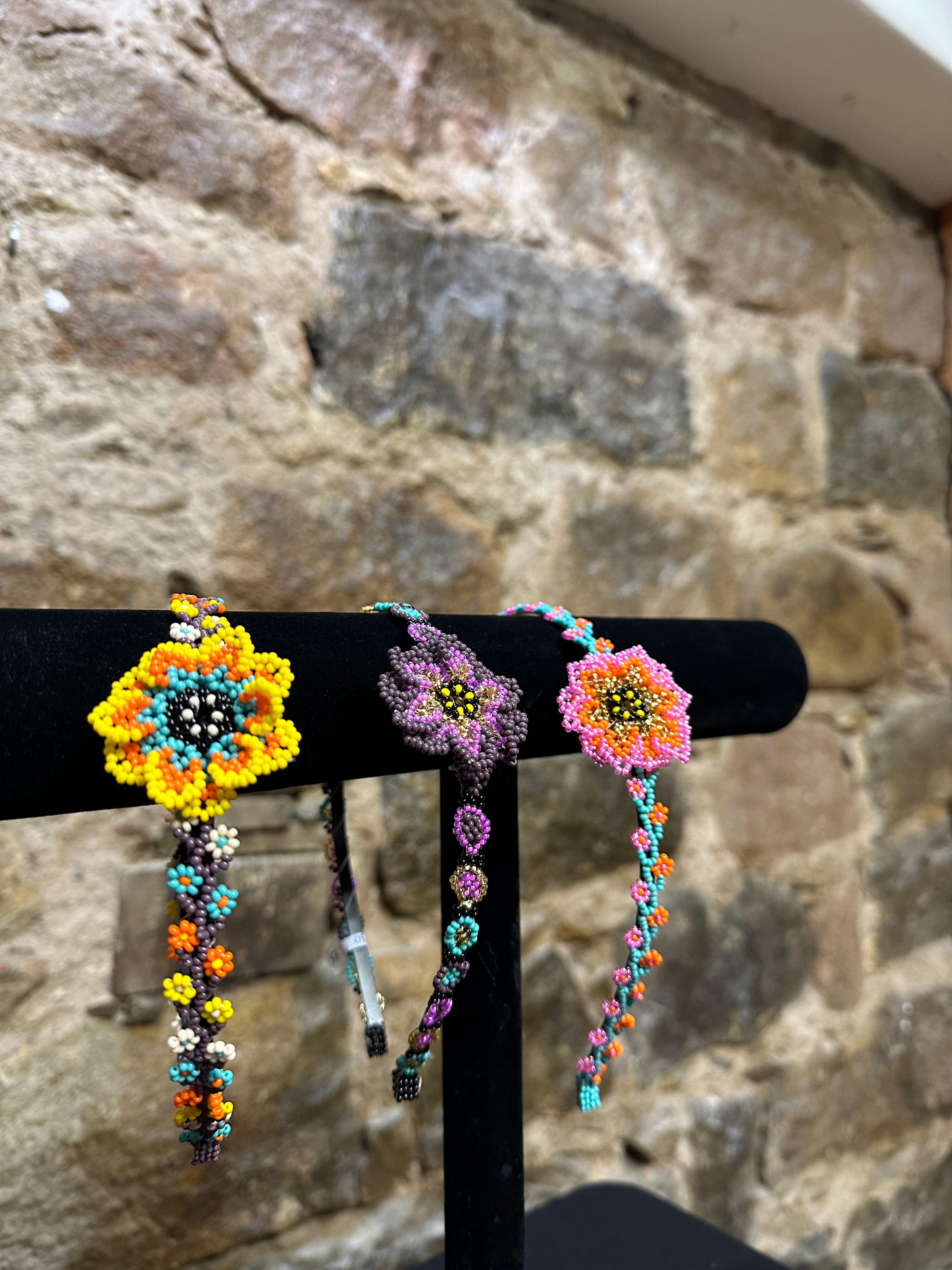 Add a burst of color to your Child's day with these cheerful small flower design beaded headbands! All of these headbands are hand made with colorful beads and intricate detail, making them a perfect addition to your child's wardrobe. Ideal for children ages 5 and up, these beaded headbands will become your child's favorite accessory, adding a unique and fun flair to their look!