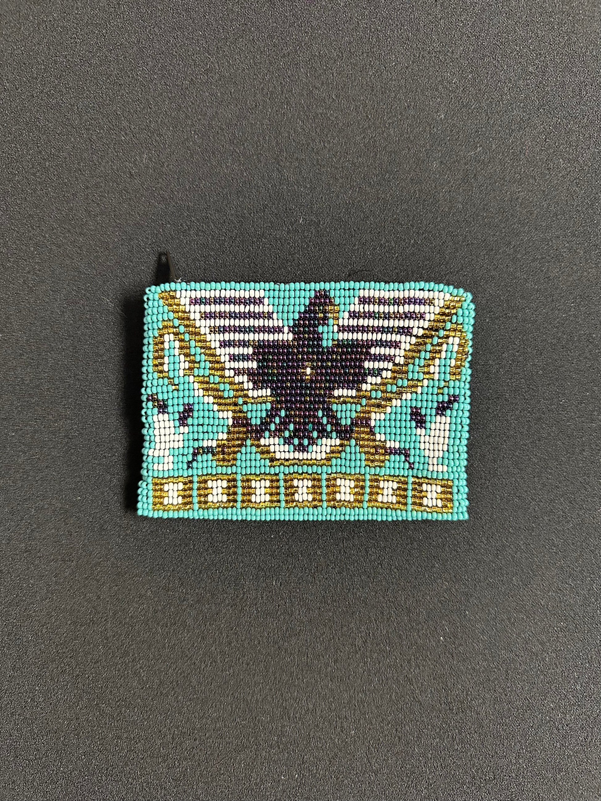 These Guatemalan Hand Beaded Coin Purses are a handcrafted piece of art. Handmade with beads, each purse is lined with a silky nylon lining and closes with a zip-top closure. They are great for organizing items in your purse or bag, and hold credit cards, IDs, metro passes, and change. Perfect for everyday use.